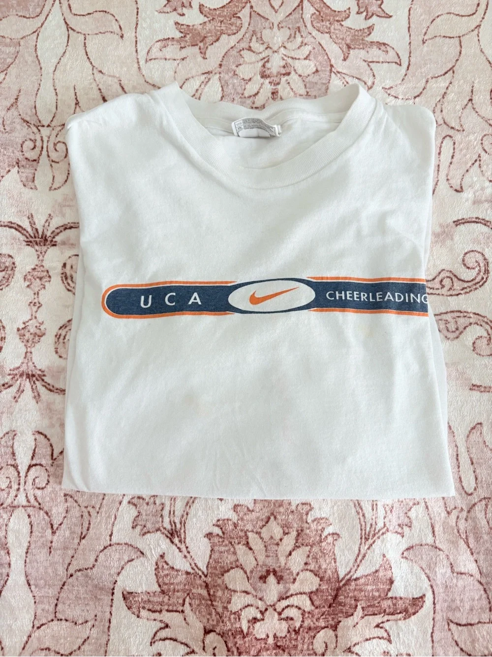 Nike White UCA Cheerleading Short Sleeve Tee with Navy and Orange Logo